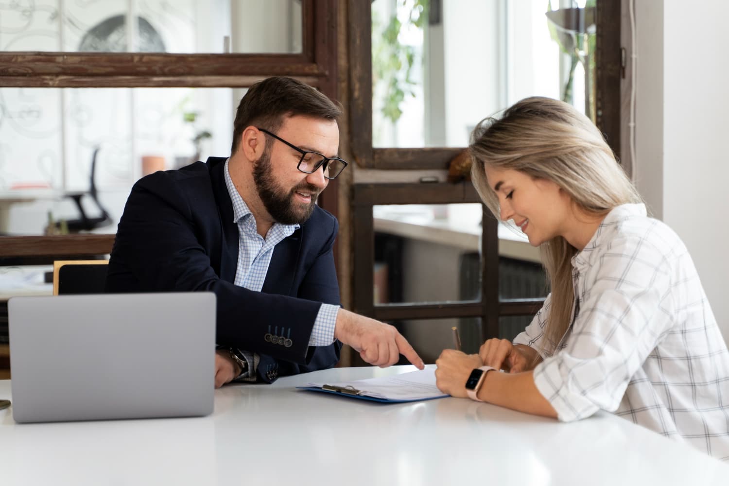 Advisors reviewing estate documents at a desk